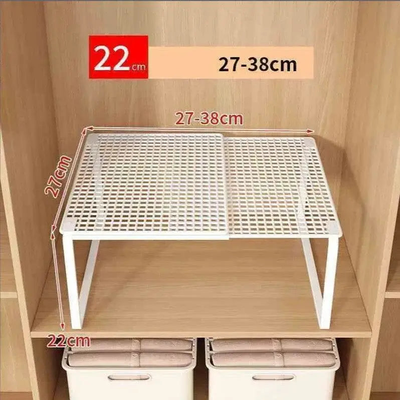 étagère de placard télescopique pliable en plastique blanc avec motif en grille et repères de hauteur réglables pour un caisson extensible et une organisation de placard télescopique empilable
