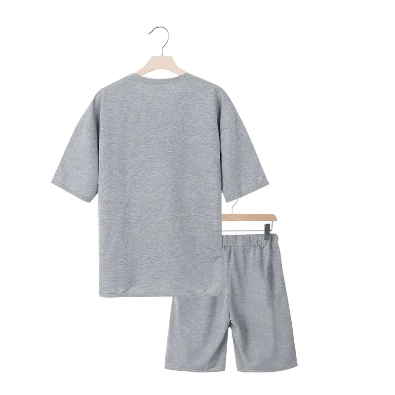 Conjunto veraniego de dos piezas para hombre, camiseta casual y conjunto de pantalones cortos en algodón gris jaspeado, con parte superior de manga corta de ajuste relajado y pantalones cortos a juego.