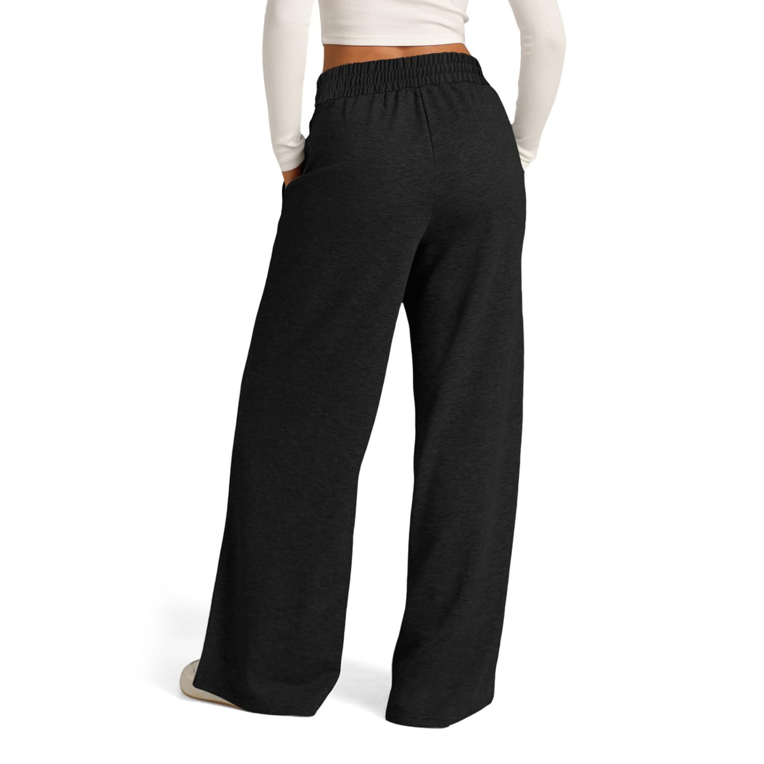 Black wide leg fleece lined sweatpants with an elastic waistband designed for women featuring a solid pattern type.