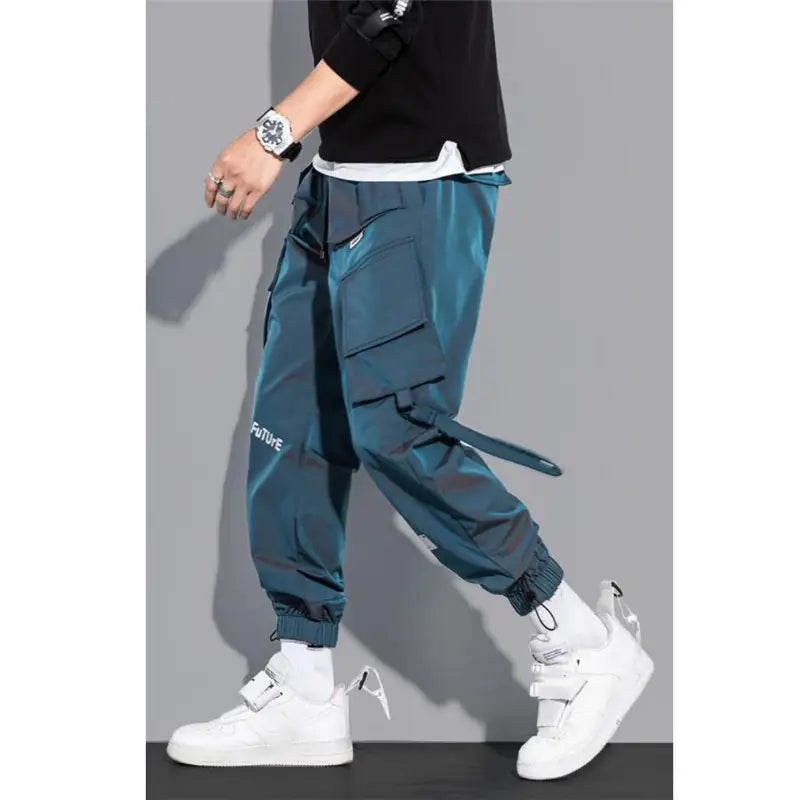 teal mens tactical cargo pants streetwear with multiple pockets and a drawstring waistband designed for practical use and comfort.
