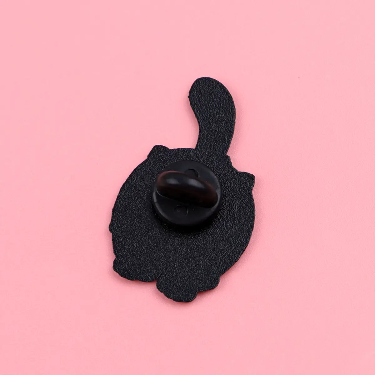 Black cat-shaped enamel lapel pin with a textured surface and a glossy black fastener from the cat enamel lapel pin set.