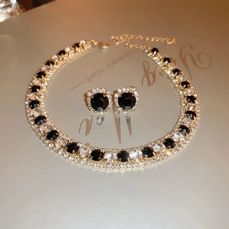 Elegant black and clear crystal choker necklace with matching stud earrings featuring a gold-tone metal setting from the crystal necklace and earring set pink ab wedding jewelry collection.
