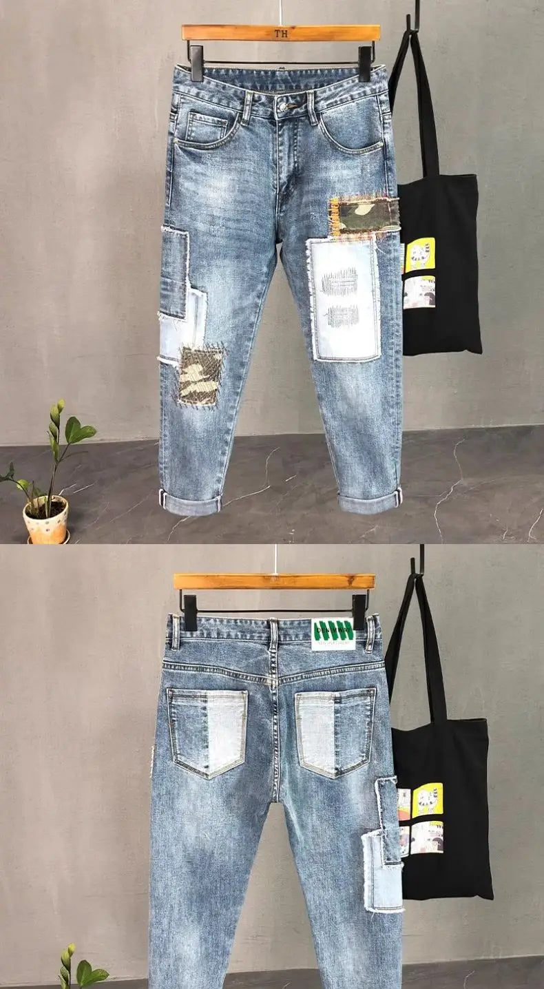 Distressed slim fit light wash denim jeans featuring distressed patches and contrasting white fabric accents.