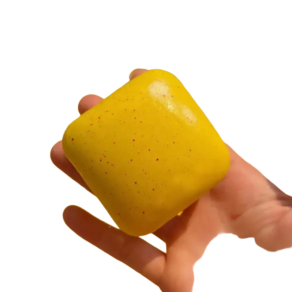 Bright yellow square mini toast slow rising squishy with glossy finish and speckles for sensory anxiety relief