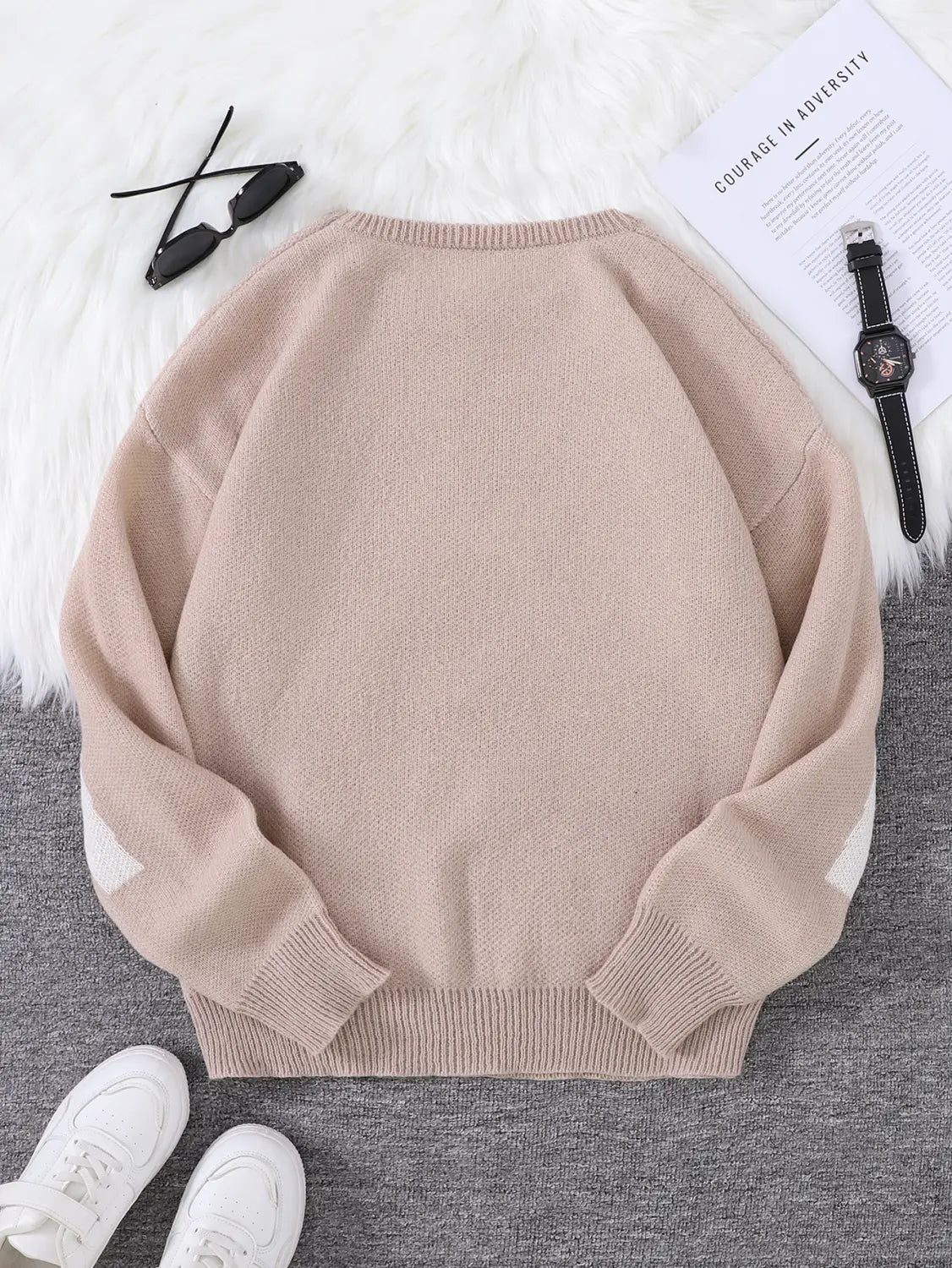 Men black amazing graphic knit sweater featuring a beige knit material with contrasting white elbow patches.