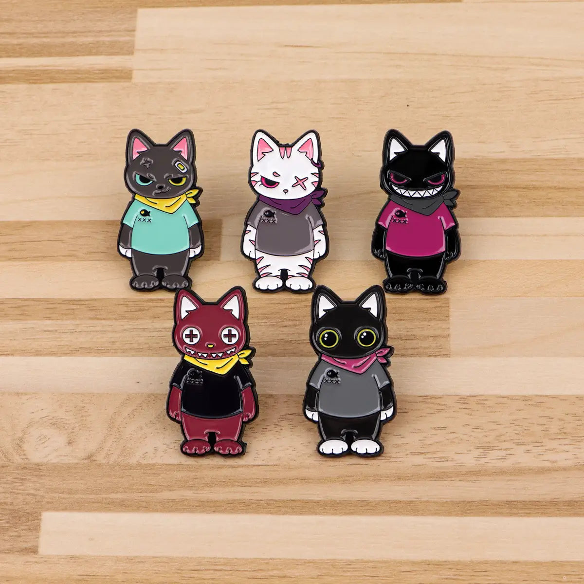 Five colorful enamel cat lapel pins featuring unique designs and outfits in a cat enamel lapel pin set.
