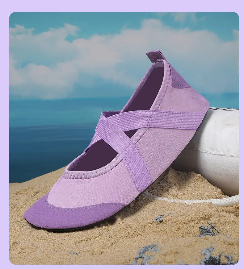 A lavender canvas women yoga shoe with elastic straps, a suede toe cap, and anti-slip fitness flats design.
