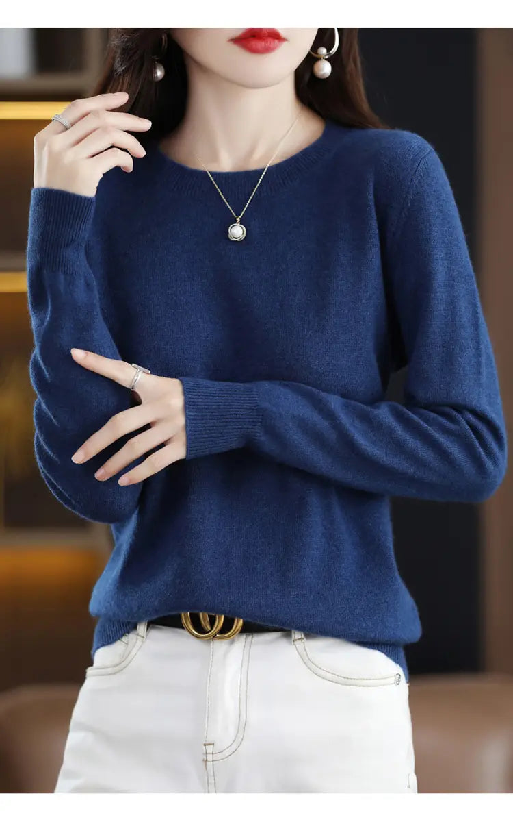 Navy blue pure wool cashmere o-neck pullover sweater with long sleeves and ribbed cuffs.