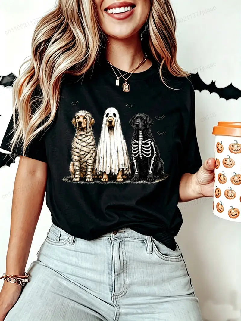 Black halloween-themed short sleeve women’s t-shirt featuring three dogs dressed as a mummy ghost and skeleton in a halloween dog graphic design.