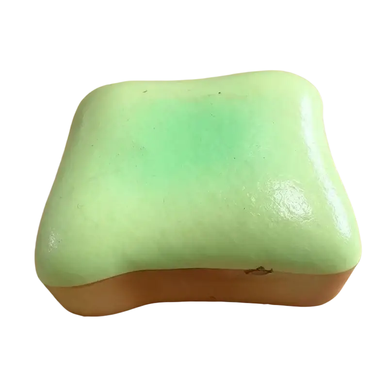 A soft mint-green silicone slow rising bread-shaped squishy stress relief toy for adult fidgeting and party favors