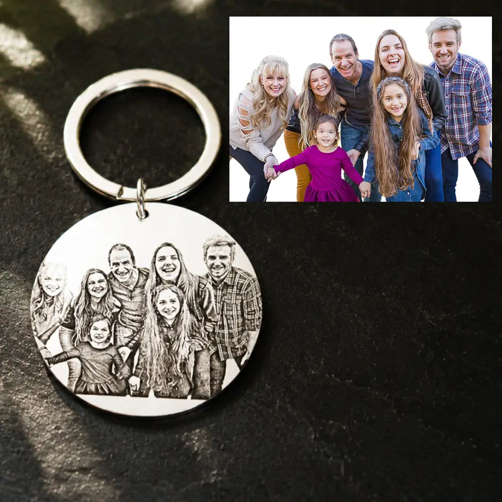 Silver circular stainless steel keychain featuring a finely engraved black and white portrait of a family in a custom photo round pendant design.