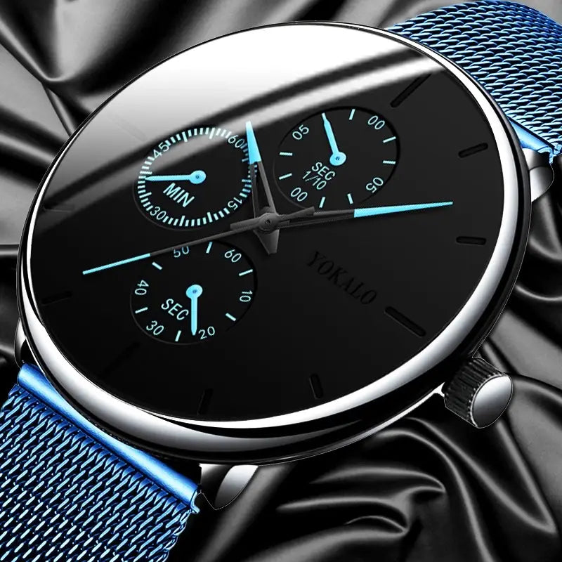 Montre à quartz ultrafine à maille noire pour hommes, présentant un chronographe sur cadran noir avec boîtier ton argent, et une sangle en maille bleu azur, avec trois sous-cadrans bleu clair.