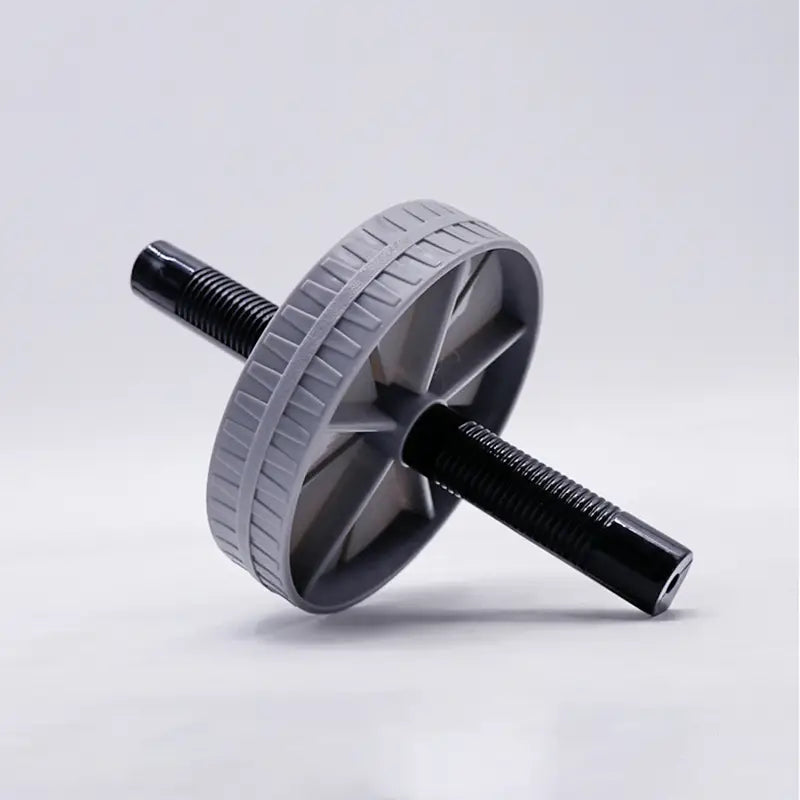 Roue d’exercice abdominale silencieuse « ab roller » gris et noire, dotée de poignées de préhension texturées, conçue pour des séances de renforcement du tronc.