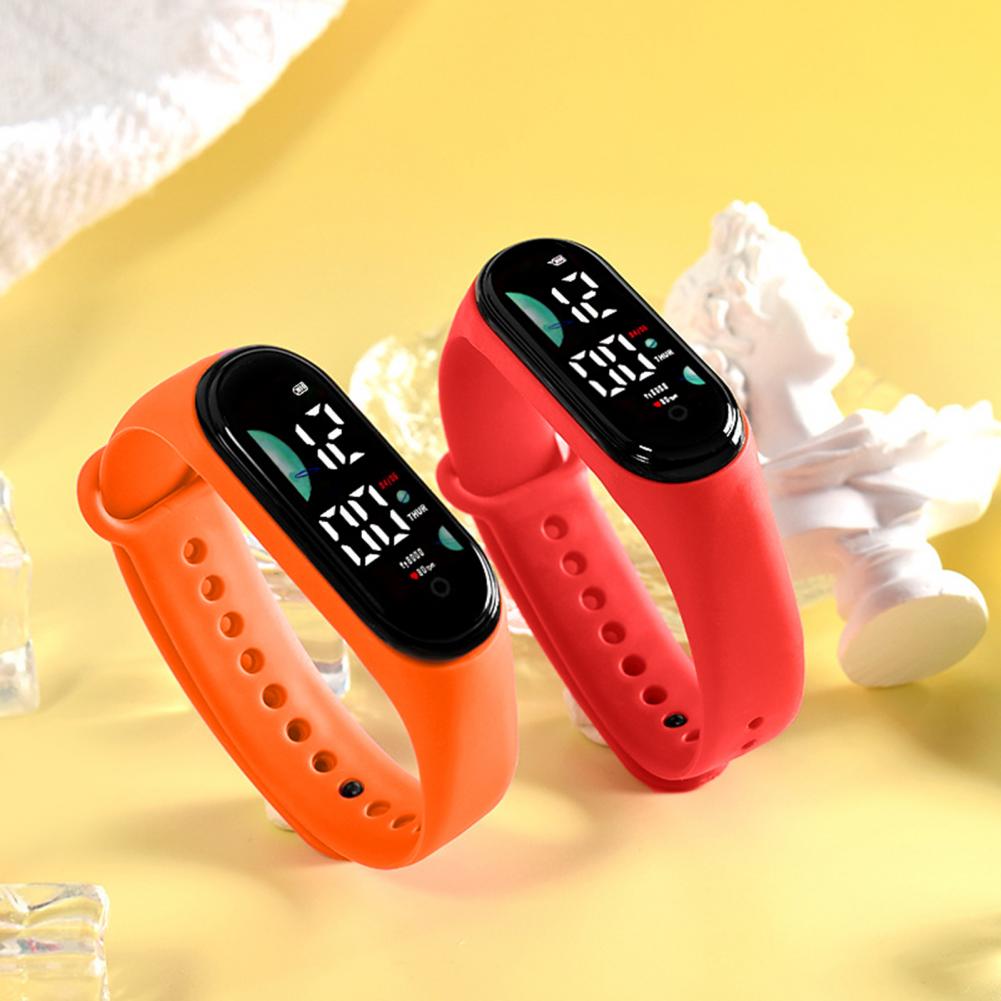 orange and red silicone electronic watches with large font screen digital displays showing time and date designed for sports use