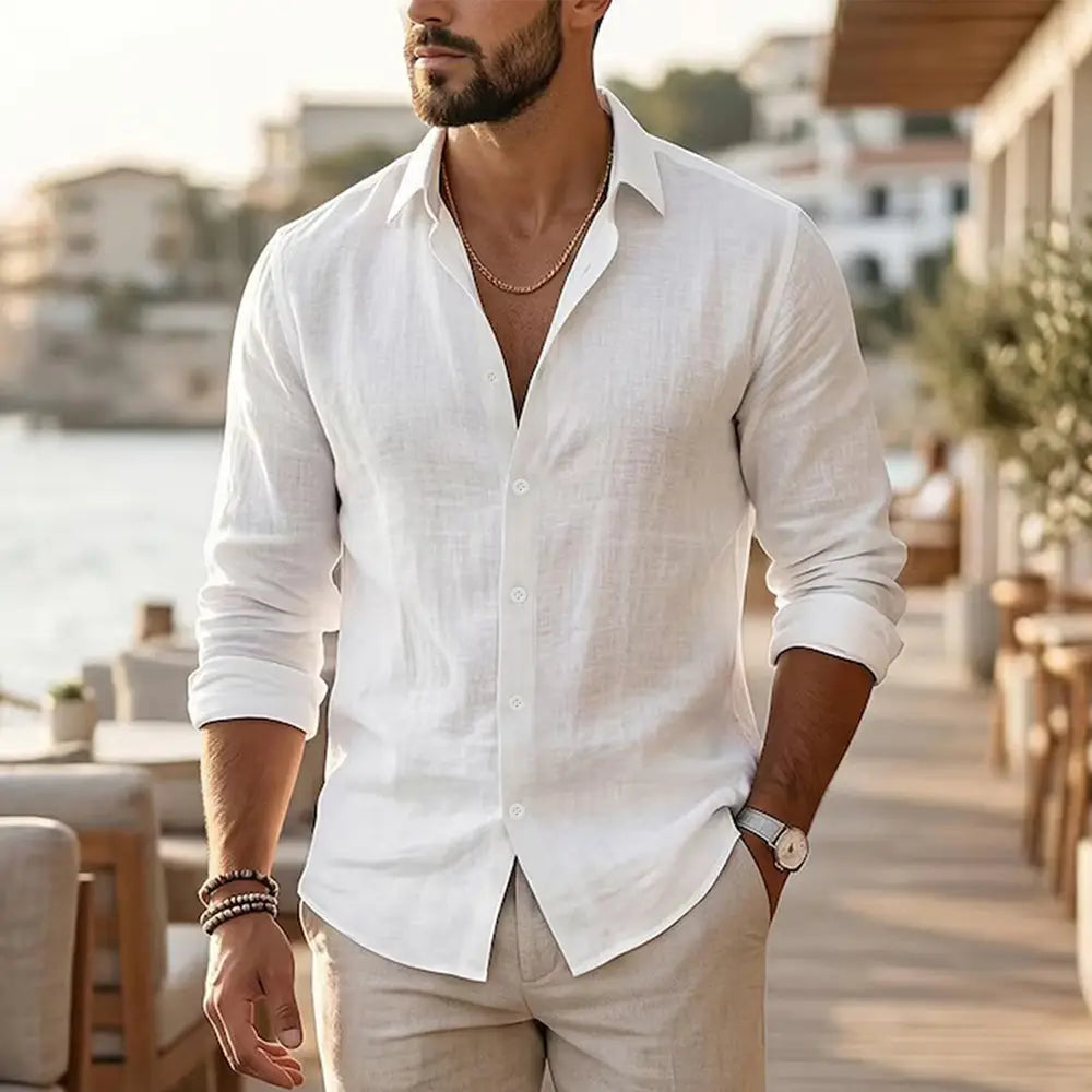 Mens cotton linen long sleeve casual shirt in white with a subtle textured weave and rolled-up sleeves.