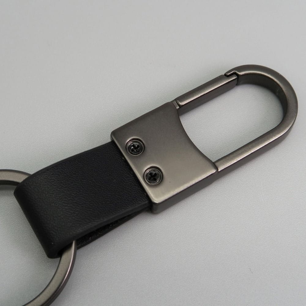 Black leather keychain carabiner with matte silver metal ring designed as an anti lost waist accessory.