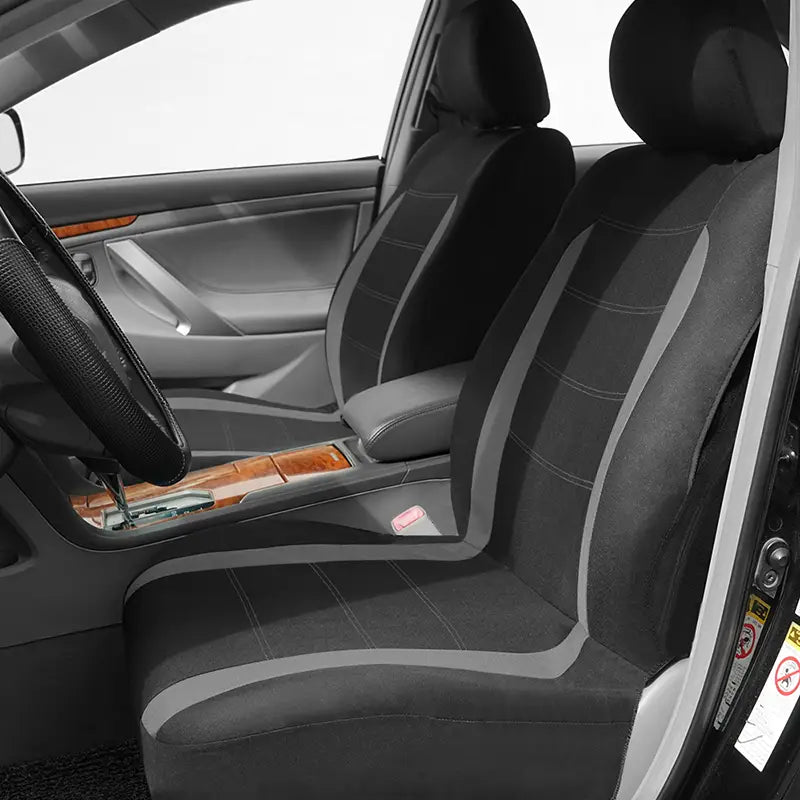 Juego completo de fundas universales para asiento de automóvil de tela negra y gris, con detalles cosidos, diseñado para mejorar la durabilidad y el estilo.