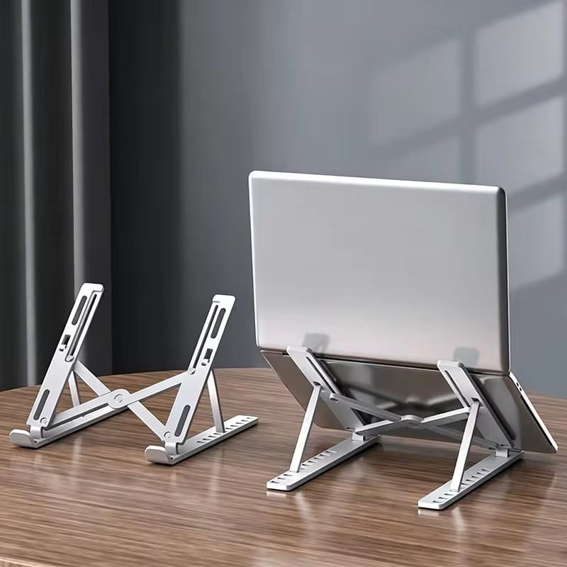 Soporte para portátil de aluminio plateado ajustable y plegable con altura y ángulo ajustables, diseñado para ofrecer un soporte ergonómico