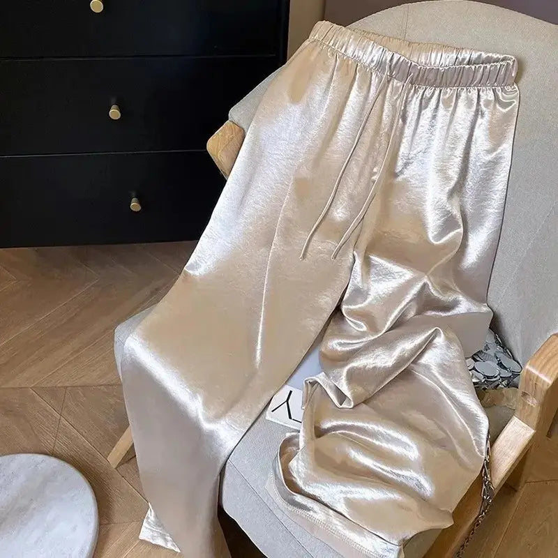 Glänzende metallische goldfarbene Satin-Hosen mit weitem Bein für Damen mit elastischem Bund und Kordelverschluss
