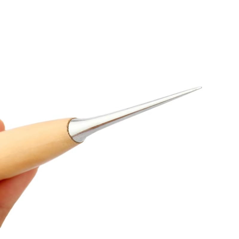 A sleek leather hole punch beading awl with a silver-tipped steel needle and a smooth light-colored wooden handle.