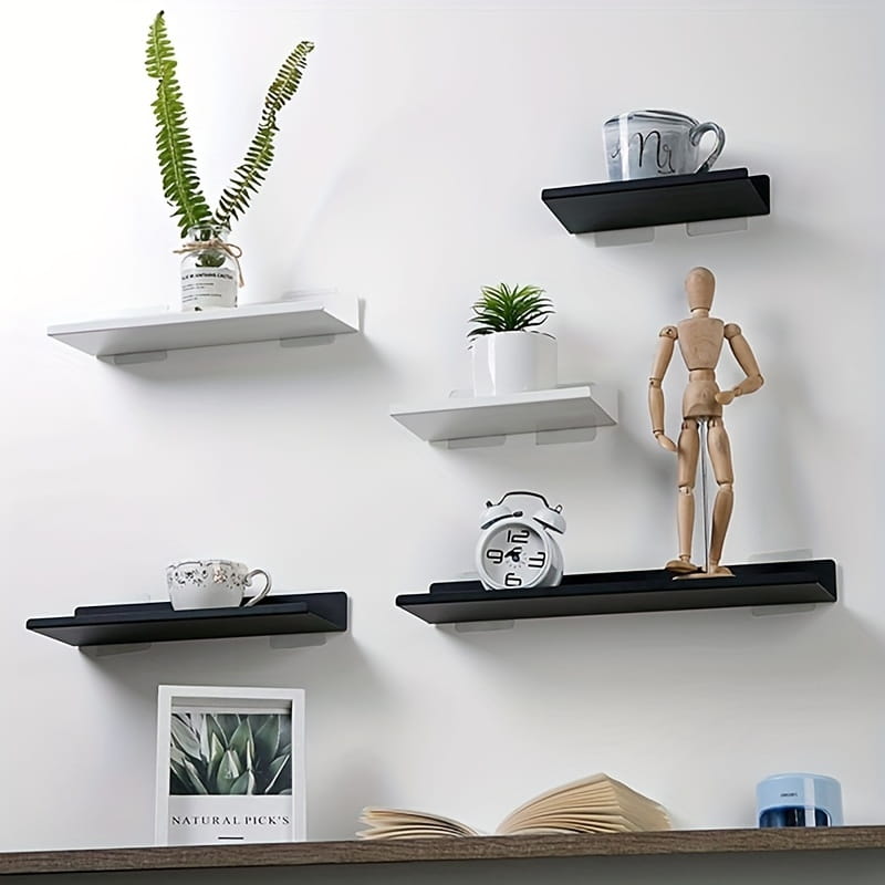 Estantes flotantes de aluminio negro mate montados en la pared, de aleación de aluminio, con un diseño minimalista, montados sobre una pared blanca, en estilo tipo montado en pared.