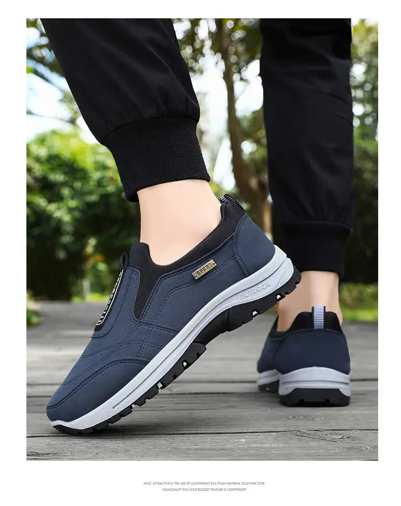 Navy blue slip-on orthopedic walking shoe for men with black accents and a white midsole designed for comfort and support.