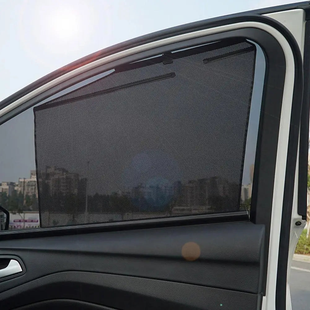 Black mesh car window sunshade with a sleek flexible design providing UV protection for retractable use