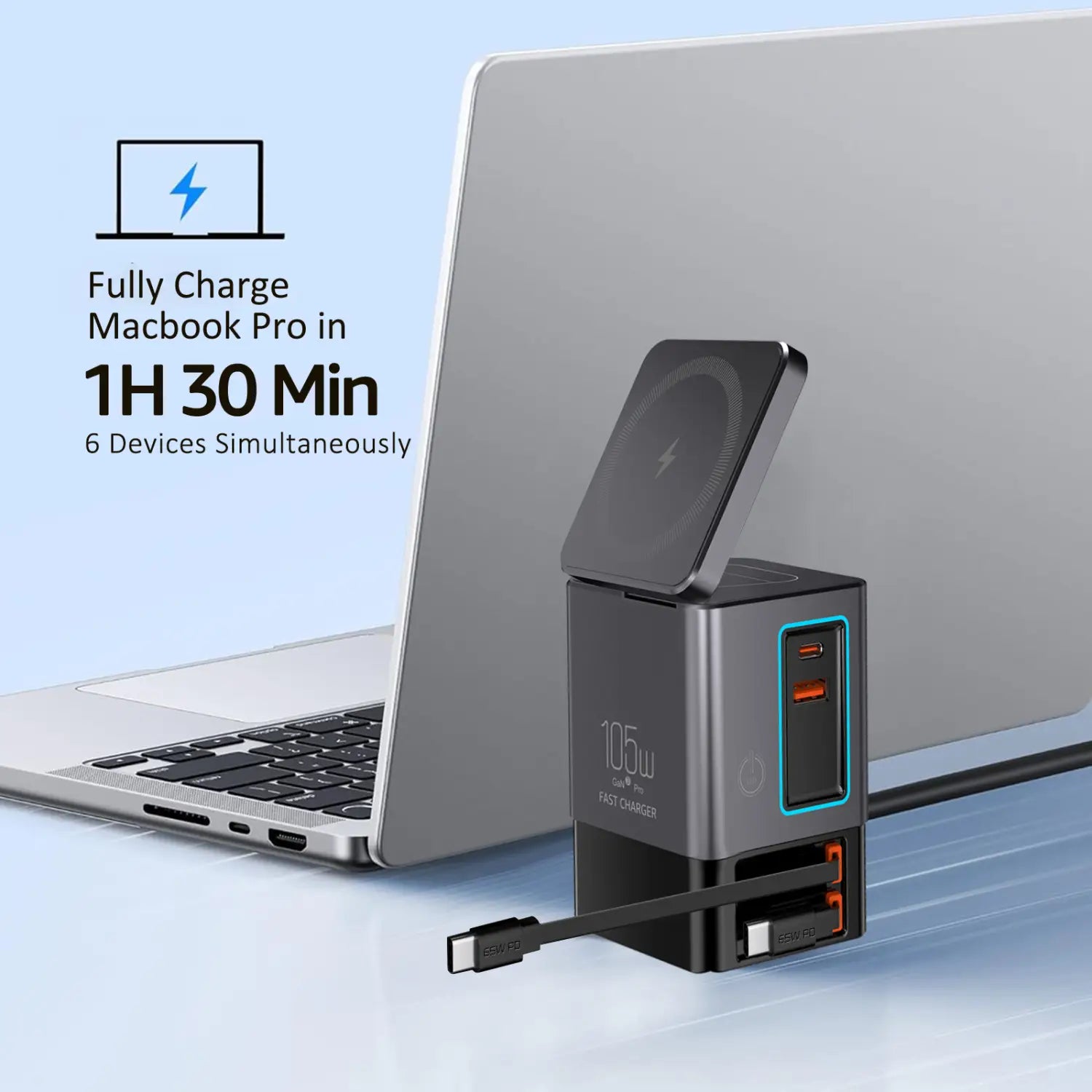 Estación de carga de 105 W en negro y plata con almohadilla de carga inalámbrica y varios puertos USB, diseñada para cargar varios dispositivos de manera eficiente.