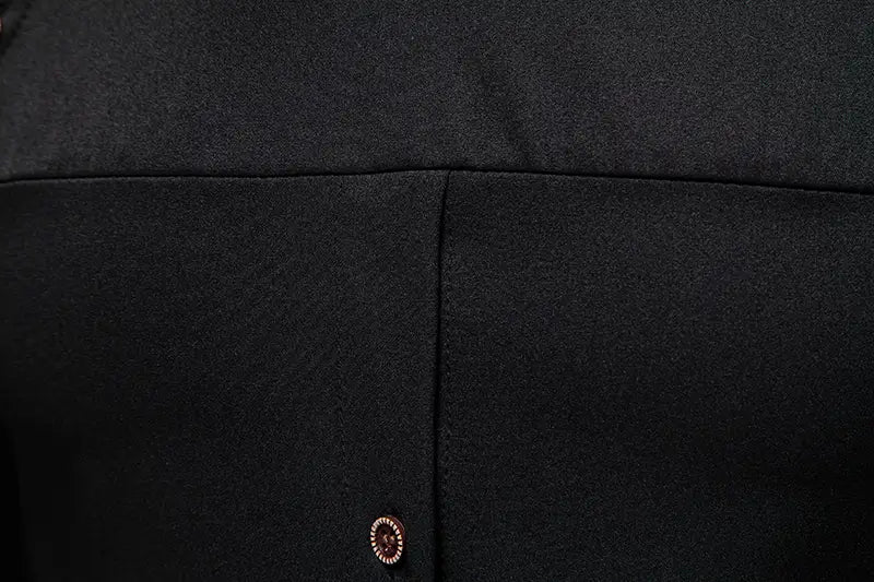 Men asymmetrical slant collar long sleeve casual shirt in black woolen fabric with a subtle textured weave and a single decorative button with an ornate metallic rim.