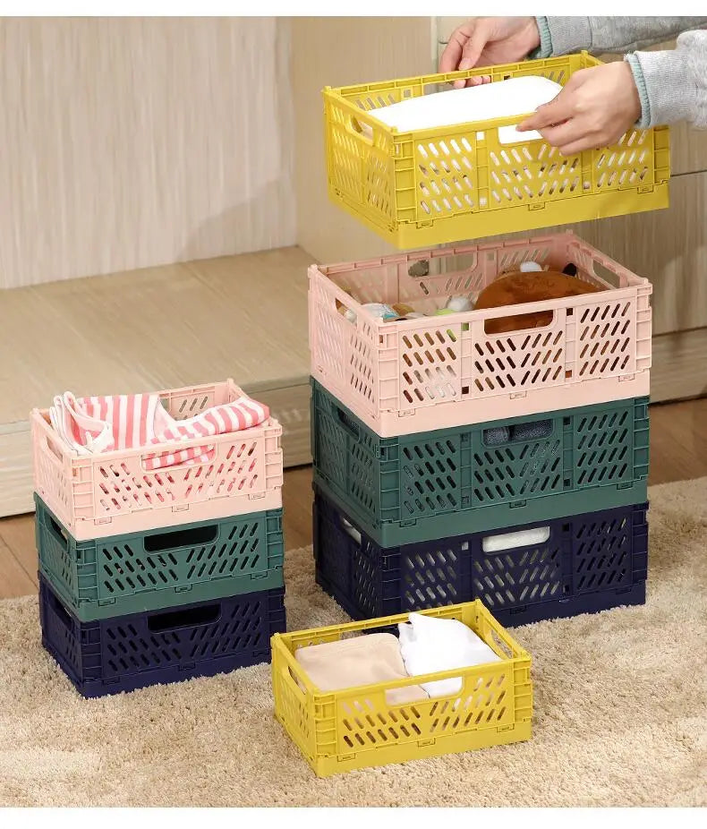 stacked pastel pink and yellow foldable storage basket crates made of plastic with lattice-patterned sides for versatile foldable storage.