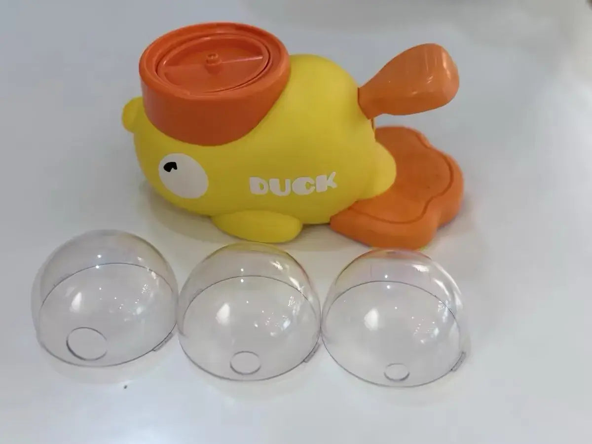 Jouet en forme de canard jaune et orange, en plastique, avec le canard imprimé sur le côté, conçu comme un distributeur automatique interactif pour animaux de compagnie de type jouets pour chat.