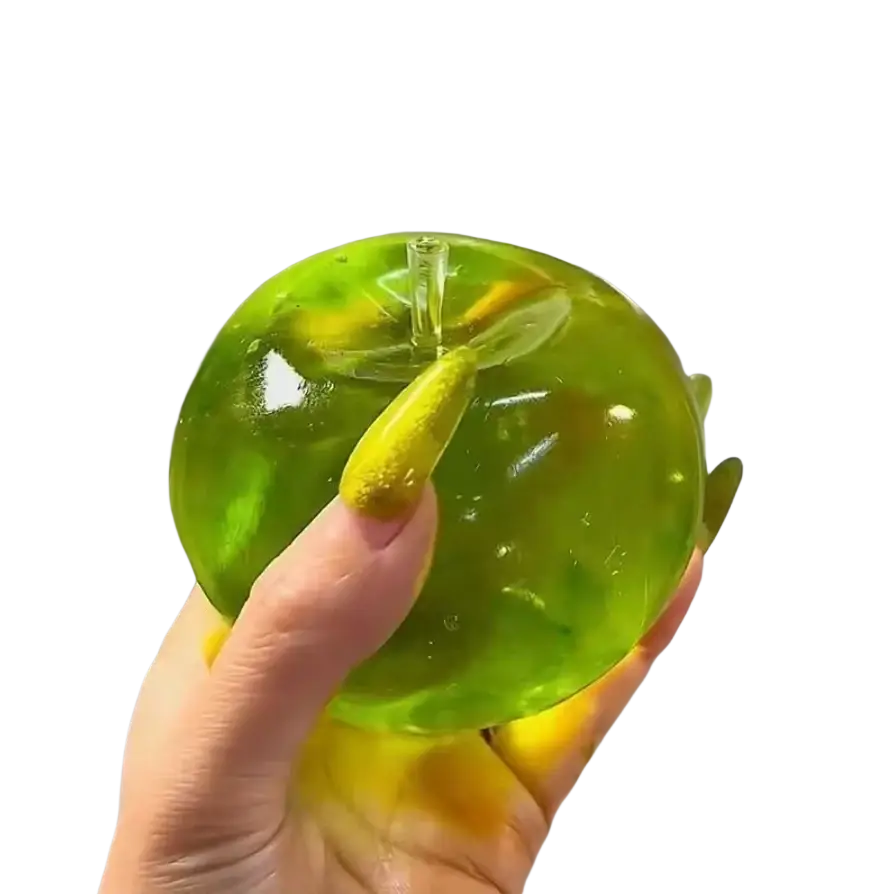 une balle anti-stress souple verte en forme de pomme vert citron translucide, avec une tige transparente et des détails internes jaunâtres, vue de face.