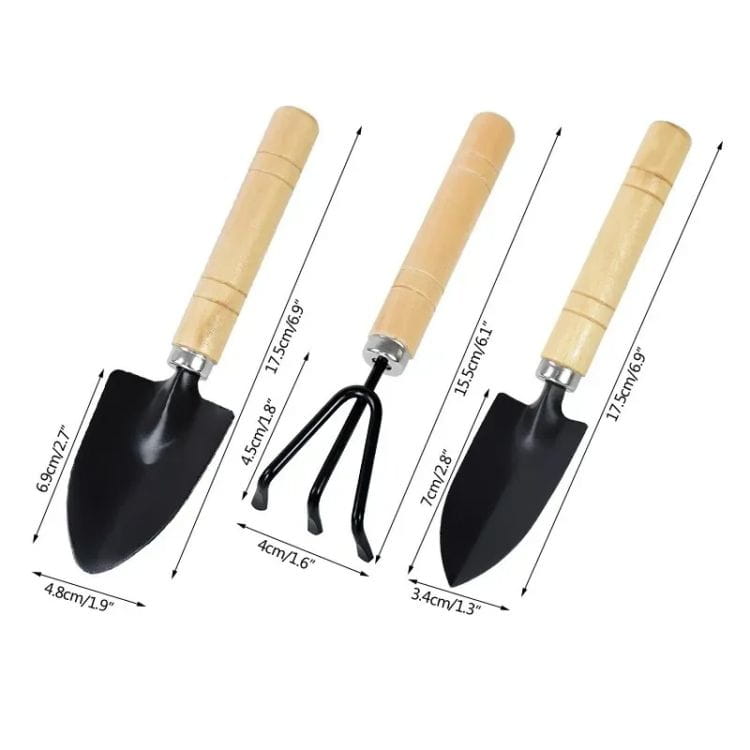 Set of three small gardening tools including a garden shovel made of black metal with light wood handles designed for small gardening tasks.