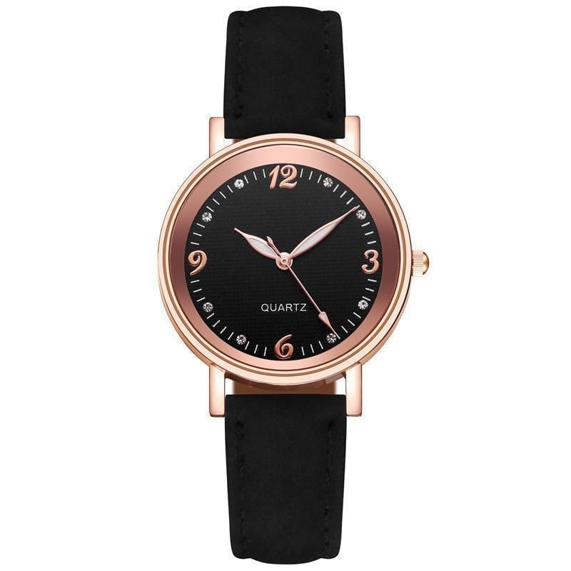 Women quartz watch with rose gold-toned case, black dial with diamond hour markers and bezel accents, rose gold-tone hands, and black leather band.
