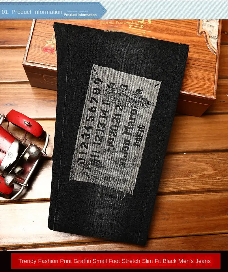 mens slim fit printed black denim jeans featuring a distressed vintage-style patch with faded text and graphics on black denim material