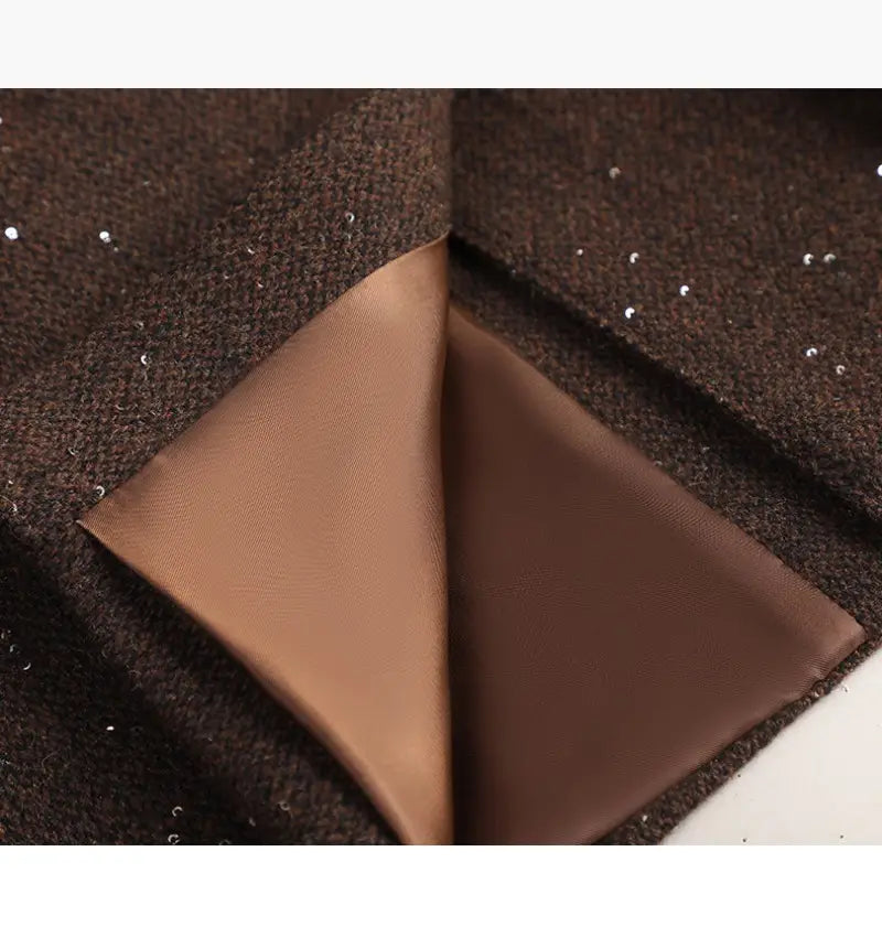 Brown wool blend double breasted blazer featuring sequined coat texture with a satin lined interior.