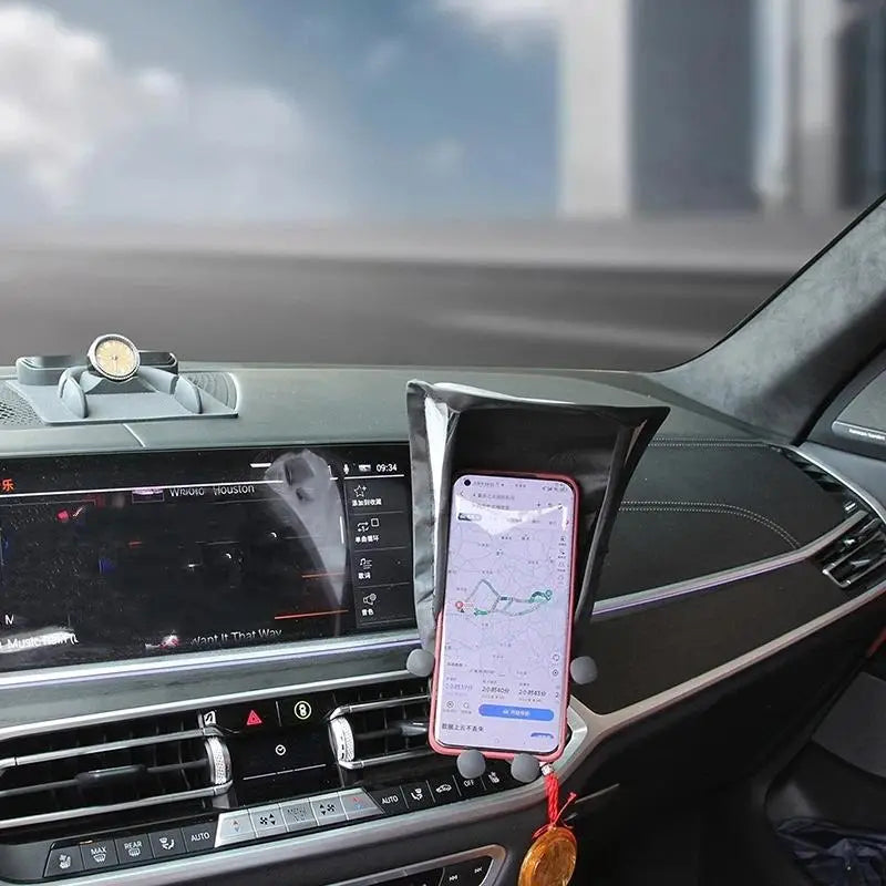 schwarzer Silikon-Telefonhalter mit grauen Saugfüßen, der ein rosafarbenes Smartphone hält, ausgelegt als Telefon-Sonnenblendengehäuse mit Anti-Blend-Plattenabdeckung