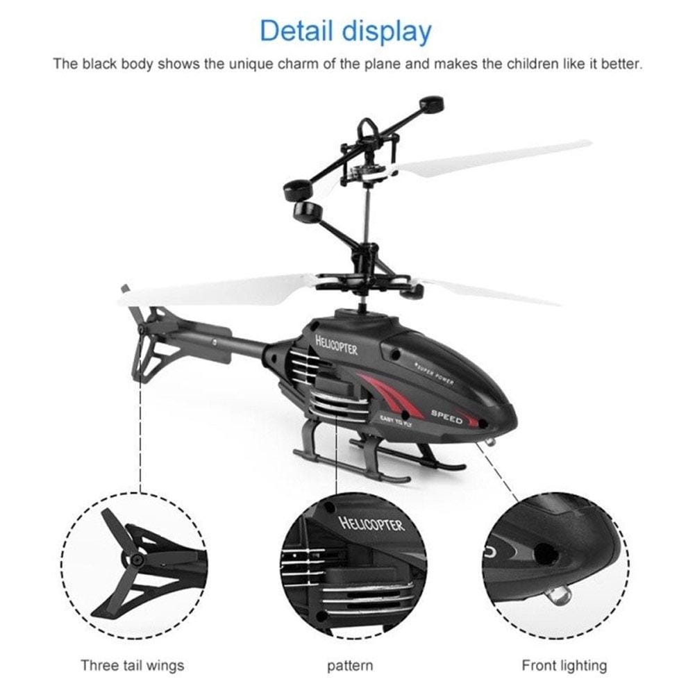El juguete de helicóptero de inducción en suspensión teledirigido con mando a distancia de marca negra y roja, con hélices blancas, diseñado para entretenimiento de vuelo en interiores.