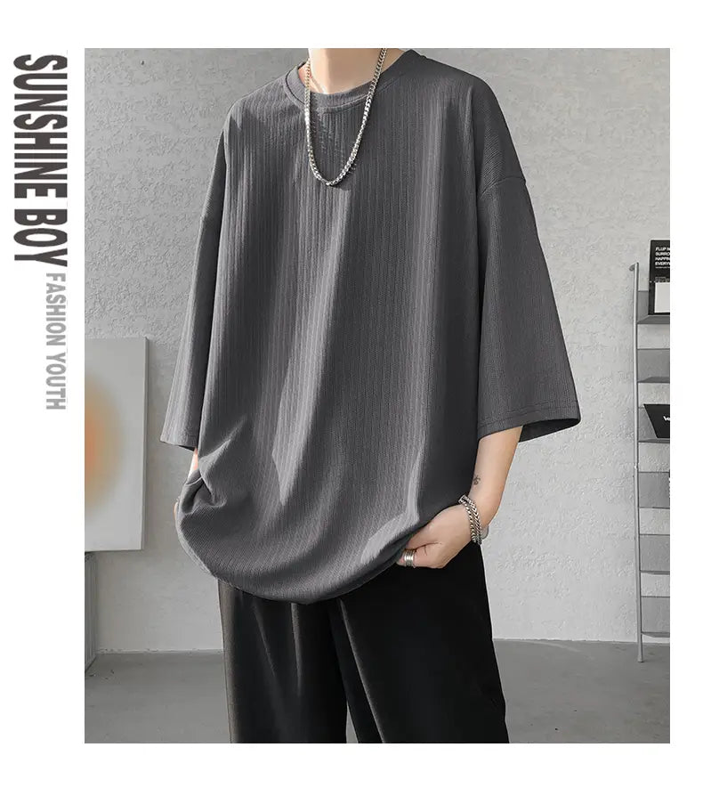 Gray ribbed cotton men striped oversized summer t-shirt with a relaxed fit and three-quarter sleeves.