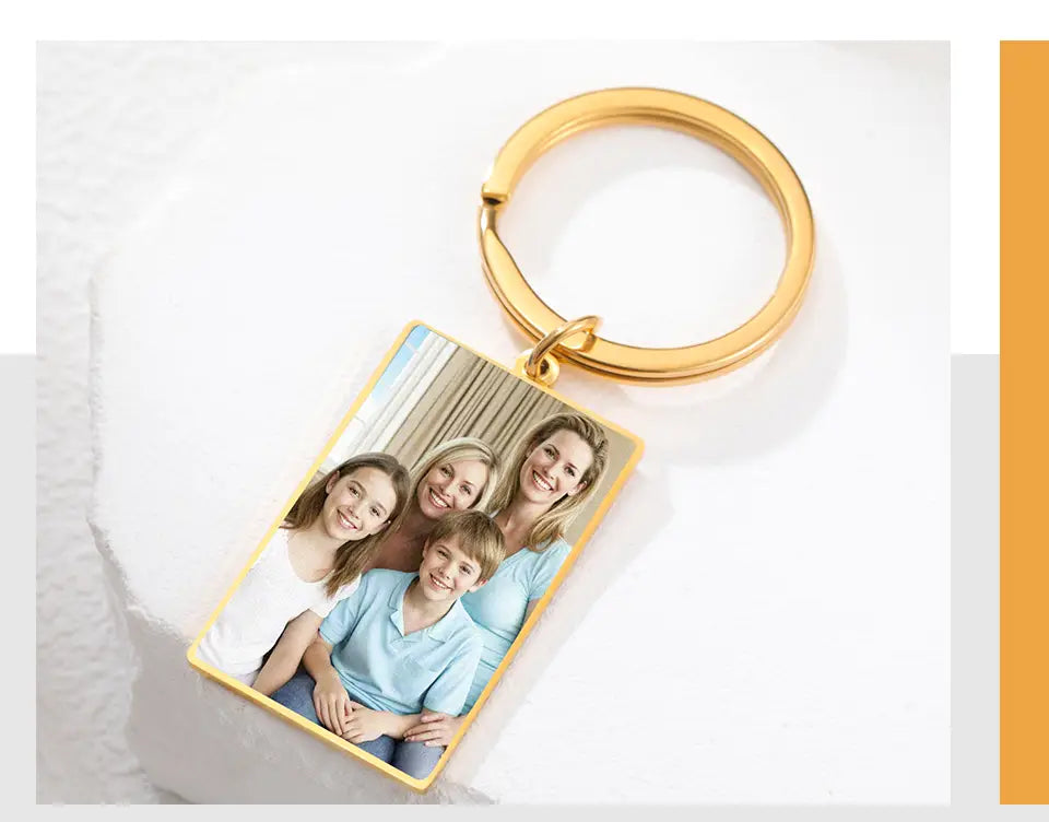 Gold-colored custom photo rectangle keychain with a family portrait featuring a personalized stainless steel ring.