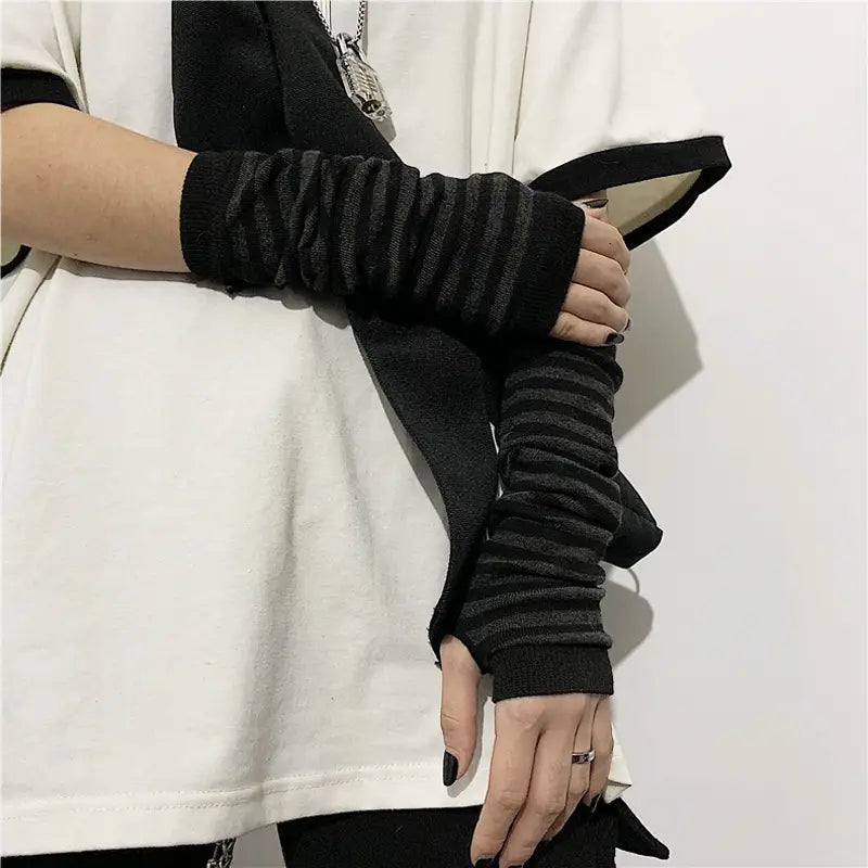 black and charcoal striped ribbed knit fingerless arm warmers made of soft textured material designed for warmth and style