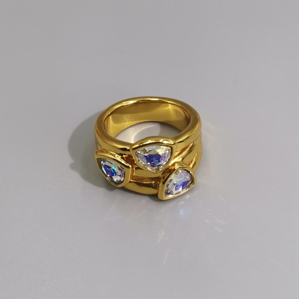 Gold-toned geometric open ring featuring three triangular iridescent stones set in a layered textured silver and gold metal band.