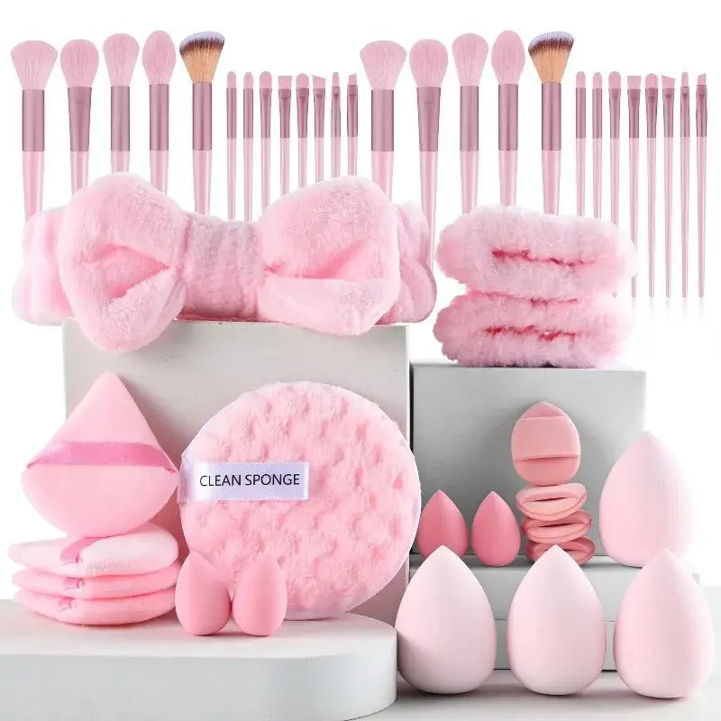 a 46 piece makeup brush and sponge set featuring pink brushes with rose gold ferrules and matching fluffy accessories designed for makeup application and eye makeup application.