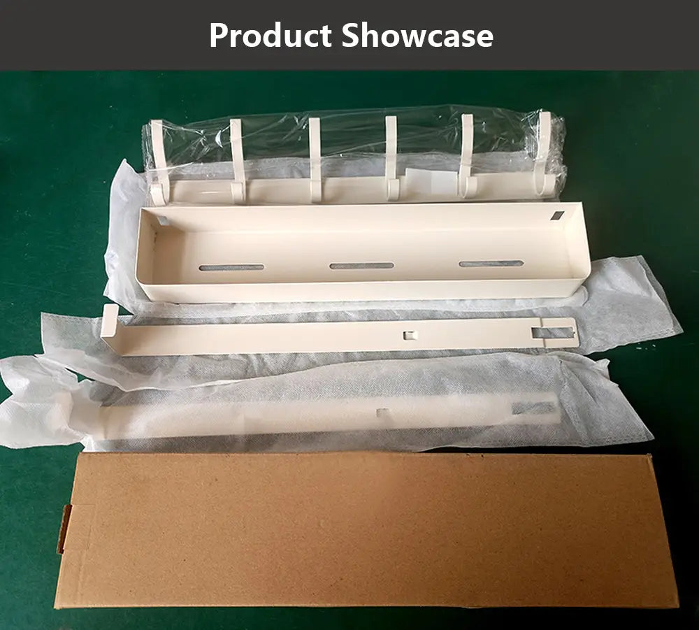 Beige plastic over door organizer with wall-mounted shelf and multiple slots and hooks for efficient storage.