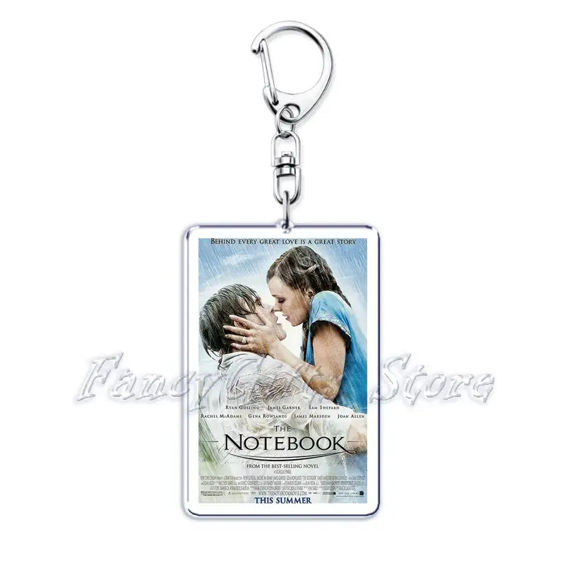 Silver rectangular acrylic keychain featuring a printed movie poster of The Notebook with Ryan Gosling and Rachel McAdams in an intimate embrace from the movie poster acrylic keychain set.