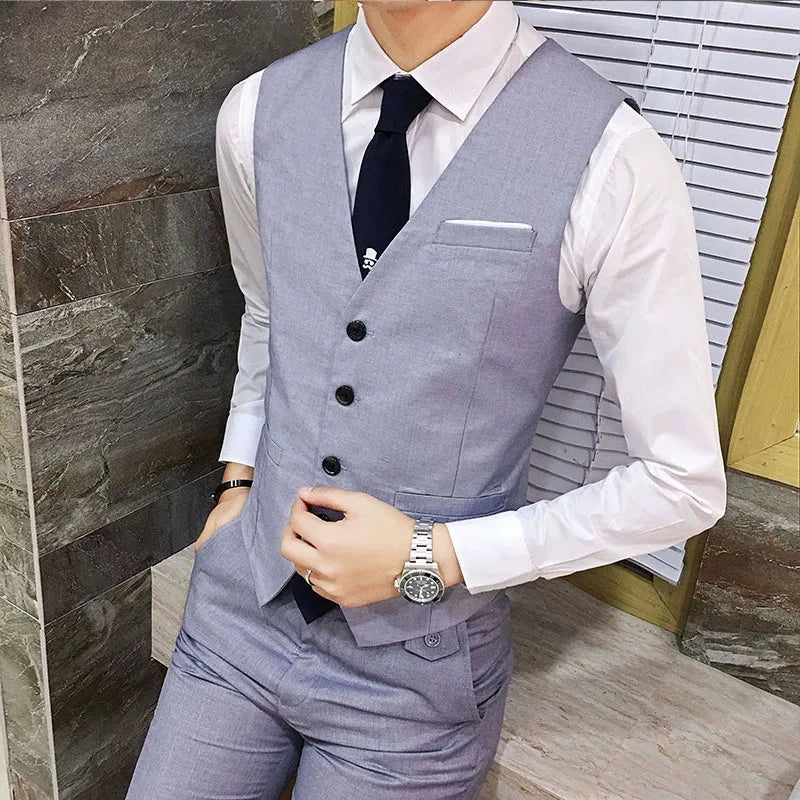 Men’s formal suit vest slim fit business waistcoat in light gray with a subtle textured weave featuring three black buttons and a single breast pocket.