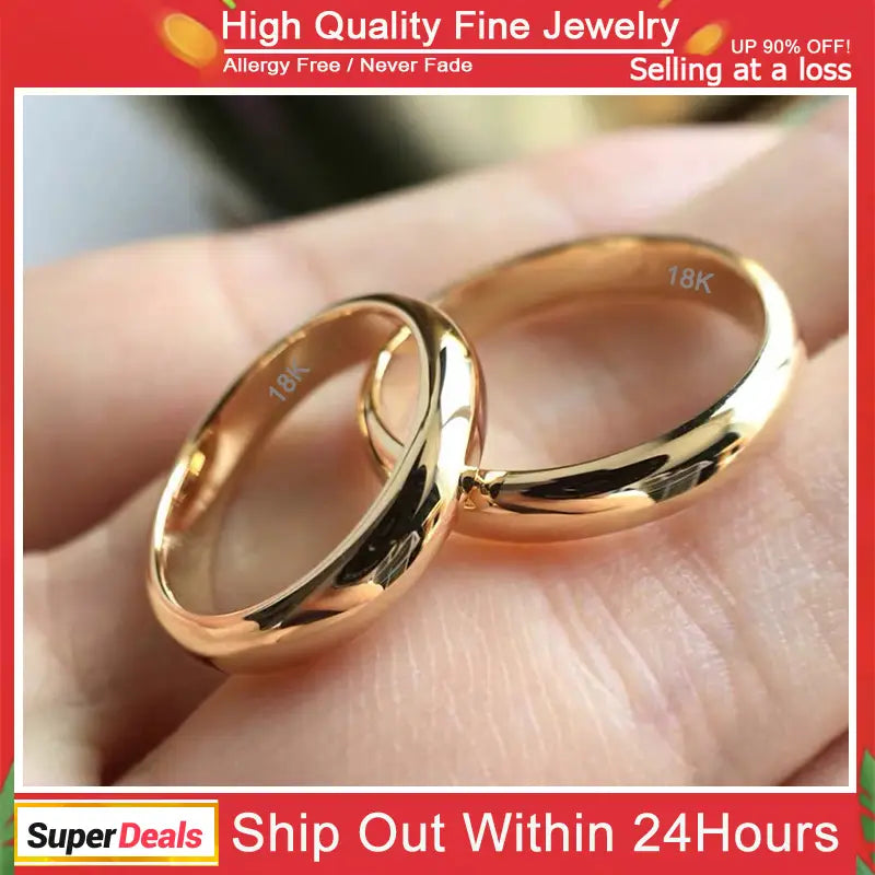 Un par de elegantes argollas de boda de oro de 18 quilates y 4 mm, pulidas y con un diseño redondeado y suave.
