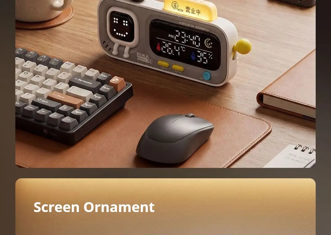 White and gray duka mooda smart temperature and humidity digital alarm clock displaying time, temperature, humidity, and a smiling face.