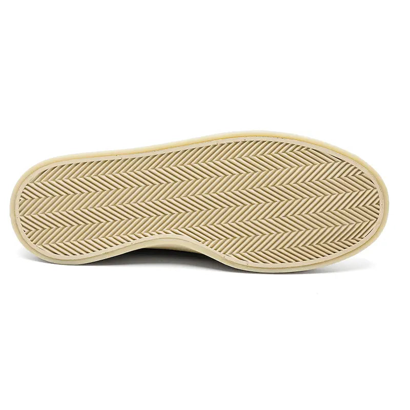 Beige herringbone patterned rubber sole of men casual suede loafers slip on walking shoes.
