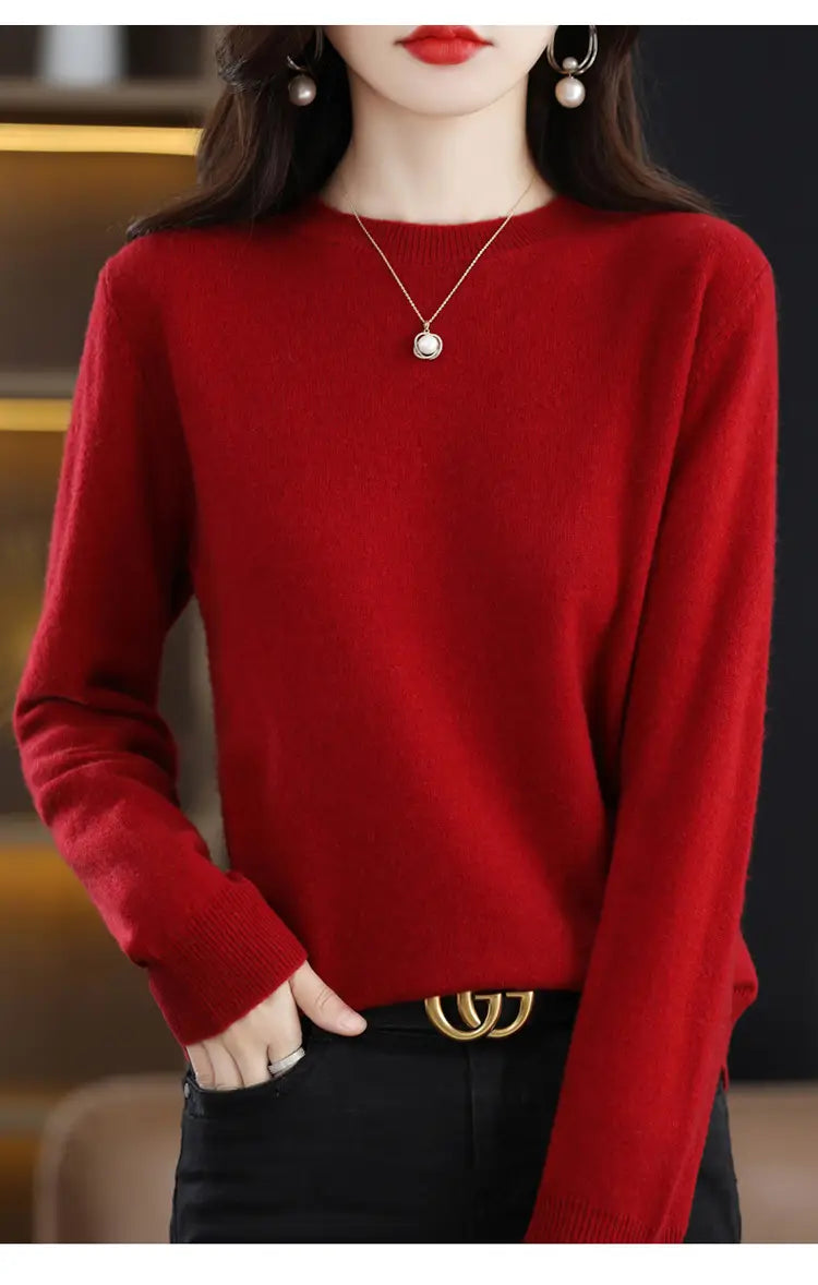 A rich red pure wool cashmere o-neck pullover sweater with long sleeves and ribbed cuffs.